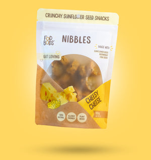 Cheesy Cheese Nibbles 100g in Packaging on Yellow Background