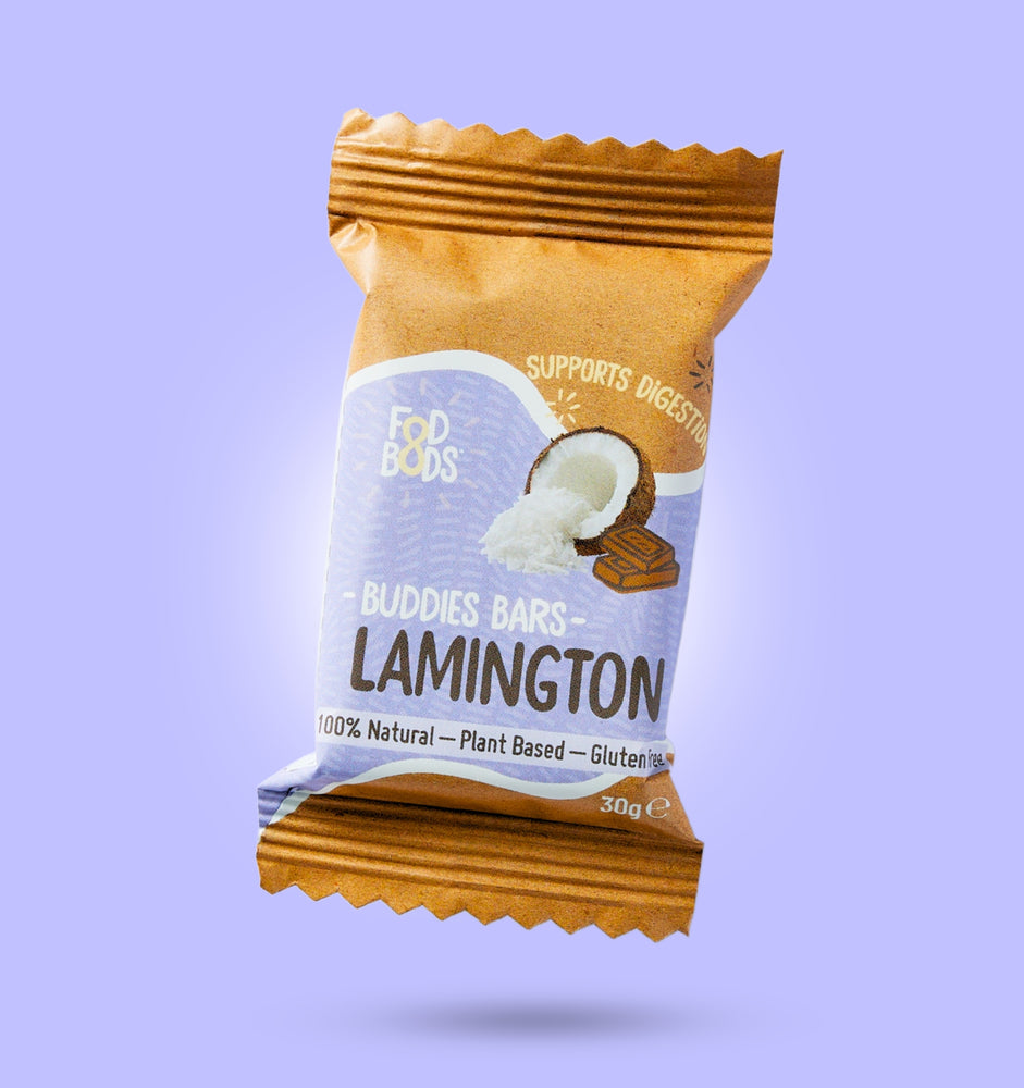 Lamington Prebiotic Buddies Bars wrapped on purple background